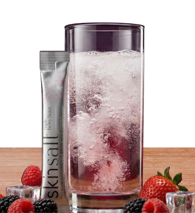 Skin Salt glass with berries on countertop